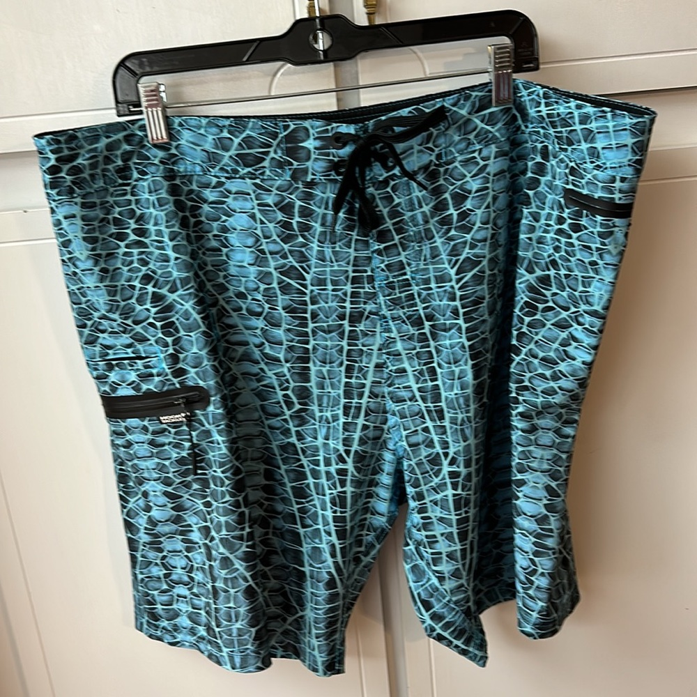 HOOK & TACKLE BOARD SHORTS. Size 40/XL. Blue. Very good used condition.